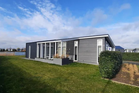 vakantiehuis-te-koop-zeeland-wemeldinge-58-003 - Haus kaufen in Wemeldinge - Perfekt gepflegtes Haus am Wasser auf eigenem Grundstück (2355)