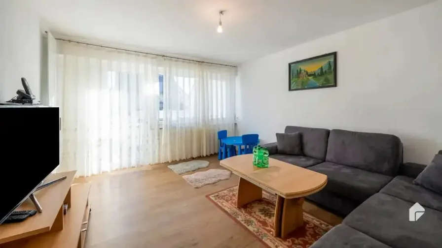 Wohnzimmer - Wohnung kaufen in Ludwigsburg / Oßweil - 3-Zimmerwohnung mit Balkon und EBK in Ludwigsburg