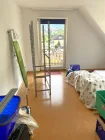 Schlafzimmer mit Zugang zum Balkon