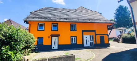 Bild1 - Haus kaufen in Seelbach - IMA-Immobilien bietet ein Mehrfamilienhaus mit 4 Wohneinheiten