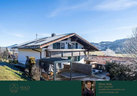 Titelbild - Haus kaufen in Rettenberg - Alpenfeeling pur: Zweifamilienhaus mit Bergblick in Rettenberg