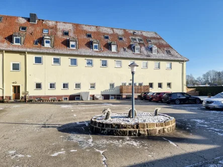 Das Wohnhaus - Wohnung kaufen in Salzgitter - 3 Zi.- Eigentumswohnung in der Waldsiedlung Salzgitter-Bad # mit Einbauküche und Stellplatz