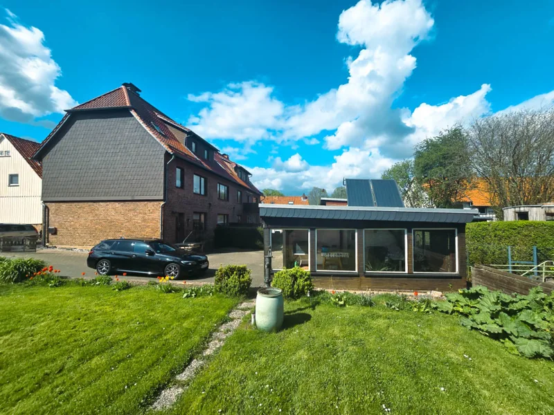 1000168698 - Haus kaufen in Wallmoden / Bodenstein - Einladendes Zuhause mit viel Platz! Doppelhaus mit Garagen in idyllischer Umgebung von Bodenstein.