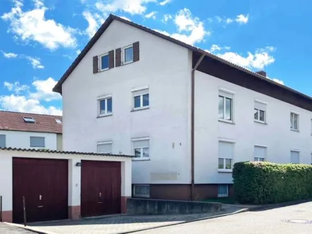 ID1044 - Wohnung kaufen in Trossingen - 4-Zimmer-Maisonette mit Garage und kleinem Garten