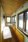 Veranda im Dachgeschoss mit Zugang zur Dachterrasse