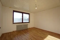 Schlafzimmer mit Laminatboden