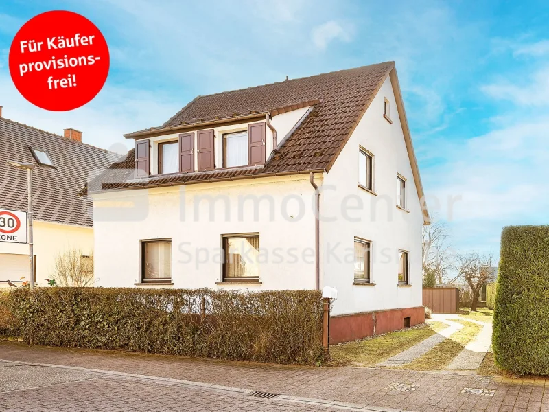 Ansicht - Haus kaufen in Linkenheim-Hochstetten / Hochstetten - Charmantes freistehendes Einfamilienhaus mit großzügigem Bauplatz in Ecklage