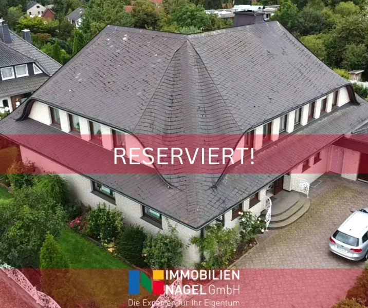 RESERVIERT! - Haus kaufen in Hüllhorst / Schnathorst - Charmante Familienresidenz mit idyllischem Garten in Hüllhorst!