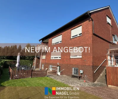 Neu im Angebot - Haus kaufen in Löhne - Vollvermietetes Dreifamilienhaus mit Garagen und Stellplätzen in Gohfeld!