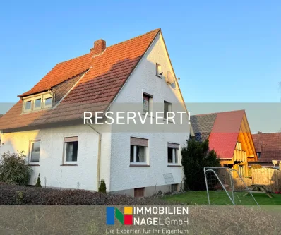 RESERVIERT! - Haus kaufen in Löhne - Zweifamilienhaus mit viel Spielraum für kreative Ideen in begehrter Wohnlage in Obernbeck