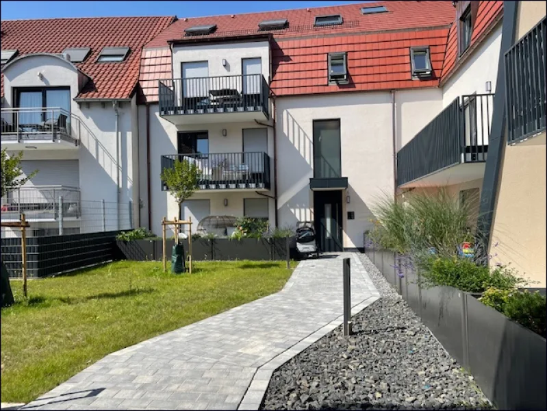 Ruhiger Innenhof - Wohnung mieten in Hockenheim - Neubau Erstbezug im KFW 55 Haus. Schicke 3-Zimmer-Wohnung mit Nolte Einbauküche!