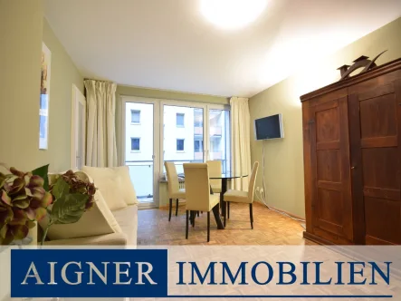 Wohnzimmer - Wohnung kaufen in München - AIGNER - Bestlage Herzogpark: Helle 1-Zimmer-Wohnung mit Westbalkon