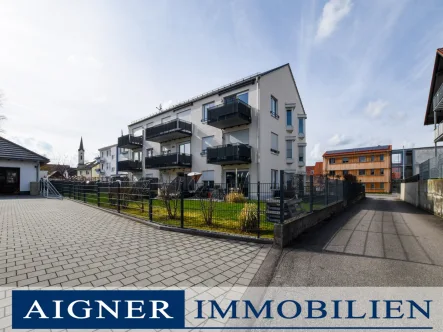 Die Hausansicht - Wohnung kaufen in Mammendorf - AIGNER-Außergewöhnliche 3-Zimmer-Dachgeschosswohnung mit Weitblick in modernem Neubau aus 2018