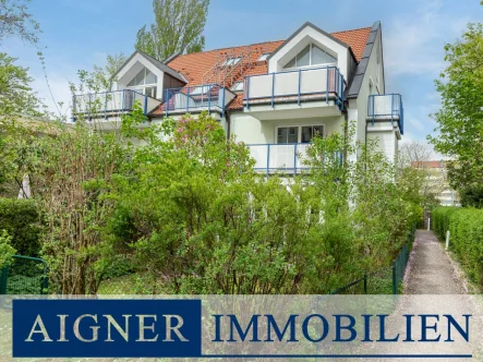 Hausansicht - Wohnung kaufen in München - AIGNER - Top geschnitten! Sonnige DG-Maisonette mit Südterrasse in grüner Innenhoflage
