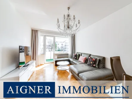 Wohn- und Essbereich - Wohnung kaufen in München - AIGNER - Charmante 3-Zimmer-Wohnung mit Süd-/Westbalkon und perfekter Anbindung an den ÖPNV