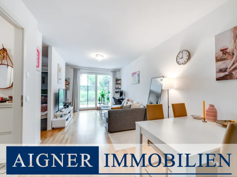 Wohnbereich - Wohnung kaufen in München - AIGNER - Moderne, möblierte 1,5# Erdgeschosswohnung mit Südterrasse und optimaler Anbindung