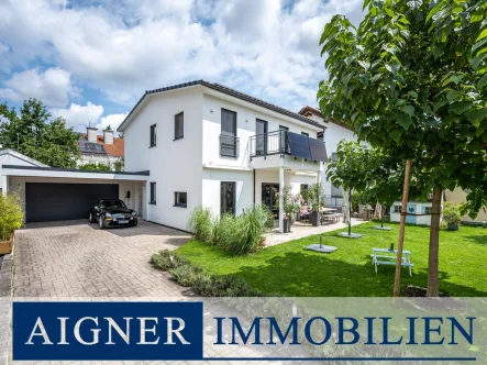 Modernes Einfamilienhaus mit sonnigem Garten, Pool - Haus kaufen in München - AIGNER - Moderne & einzigartige Stadtvilla mit großen Garten im Norden Münchens