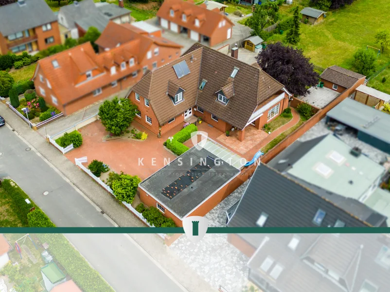 Titelbild - Haus kaufen in Langwedel - Mehrfamilienhaus auf traumhaftem Grundstück mit Blick in die Wiesen