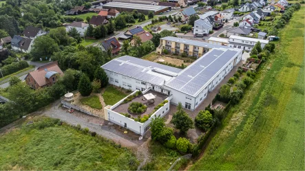 Titelbild - Zinshaus/Renditeobjekt kaufen in Triefenstein / Trennfeld - Moderne Wohnanlage in romantischer Lage von Triefenstein