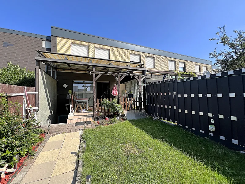 Hausrückseite_Garten - Haus kaufen in Rheda Wiedenbrück - Gepflegtes Reihenendhaus mit Garten auf Erbpachtgrundstück in begehrter Lage von Wiedenbrück