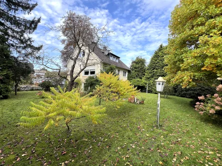 Gartenansicht - Haus kaufen in Bielefeld - Attraktives Dreifamilienhaus mit kleinem Gewerbeanteil in sehr guter Lage von Schildesche