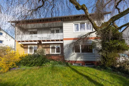 Ansicht - Wohnung kaufen in Steißlingen - Kinderfreundliche Erdgeschosswohnung mit Garten, Garage und Carport