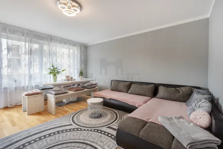 Wohn/Essbereich - Wohnung kaufen in Unterföhring - MÜNCHNER IG: Traumhaft geschnittene 3-Zimmerwohnung mit großem Süd-Balkon!