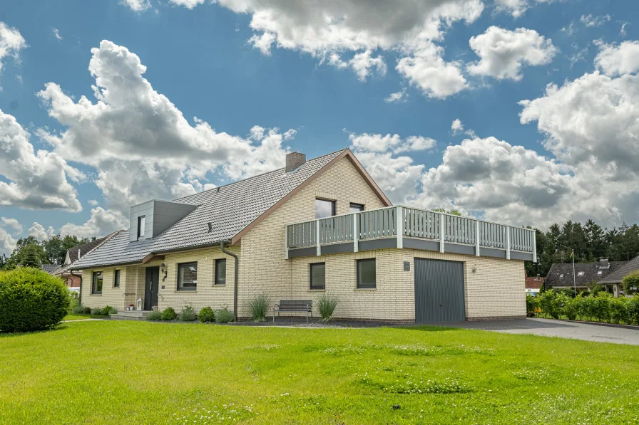 Außenansicht - Haus kaufen in Wischhafen - Direkt einziehen und wohlfühlen! Modernisierter Einfamilientraum in ruhiger Lage.