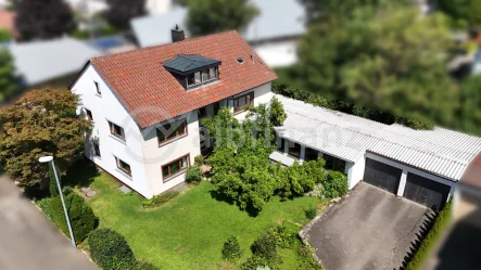 Außenansicht - Haus kaufen in Reutlingen-Ohmenhausen - Vier Herzen schlagen in einer Brust: Mehrfamilienjuwel auf großem GST für Anleger oder Eigennutzer!