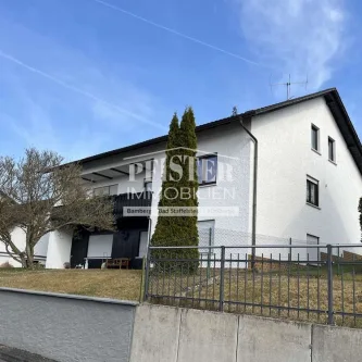 Außenansicht - Haus kaufen in Oberaurach - Großzügiges Einfamilienhaus mit Einliegerwohnung und Ausbaureserve in Oberaurach OT
