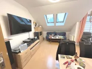 Wohn/Esszimmer mit gemütlicher Sofa-Ecke