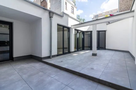 Original Sonnenterrasse - Wohnung kaufen in Köln - EIN KUNSTWERK AM AGNESVIERTEL: VIER ZIMMER NEUAUSBAU MIT TERRASSE IN RUHIGER LAGE – PROVISIONSFREI