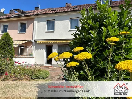 Gartenansicht - Haus kaufen in Nürnberg - Einfach Zuhause! Gepflegtes Familien-Reihenmittelhaus mit Garage in Nürnberg-Thon