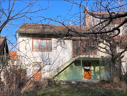 Gartenansicht - Haus kaufen in Aschaffenburg / Gailbach - Ein Haus zum renovieren - Südwest-Grundstück mit Bachlauf