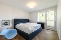 Schlafzimmer mit Balkonzugang