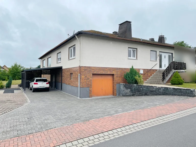 Titelbild - Haus kaufen in Eppenrod - Eppenrod: Großzügiges Einfamilienhaus mit viel Platz für Familie und Hobby