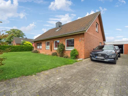 Hausansicht - Haus kaufen in Lensahn - Gemütliches Einfamilienhaus in ruhiger Feldrandlage von Lensahn mit sehr guter Anbindung BAB1