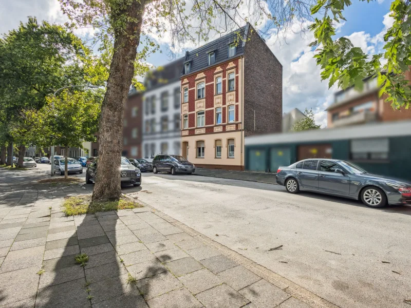 Titelbild - Haus kaufen in Duisburg - Charmantes und gepflegtes Mehrfamilienhaus im schönen Duisburg Meiderich 