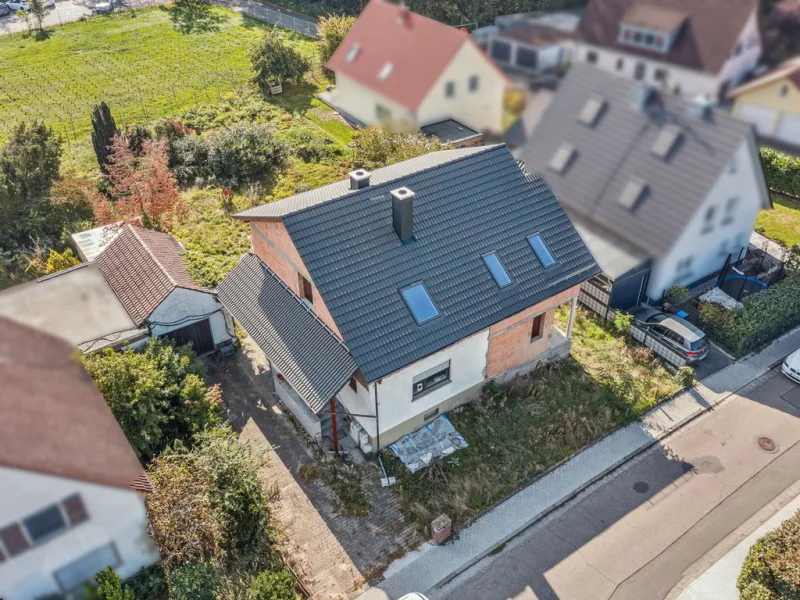 Luftaufnahme  - Haus kaufen in Limburgerhof - Rohbau-Immobilie mit großem Grundstück in Limburgerhof 