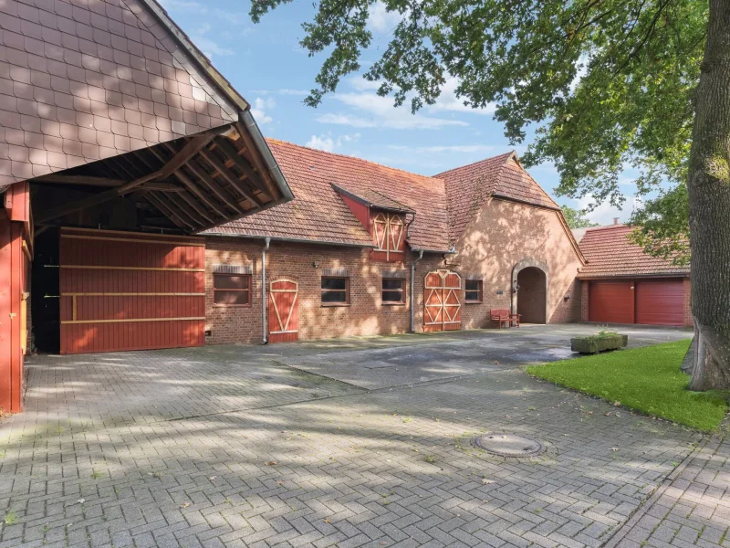 Titelbild - Haus kaufen in Diepenau - Charmantes und renoviertes Bauernhaus in idyllischer Lage in Diepenau