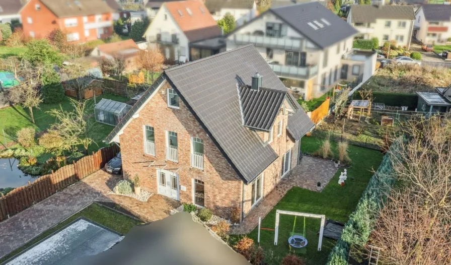 Titel Neu - Haus kaufen in Verl - Modern und effizient - Neuwertiges Einfamilienhaus in Verl-Sürenheide