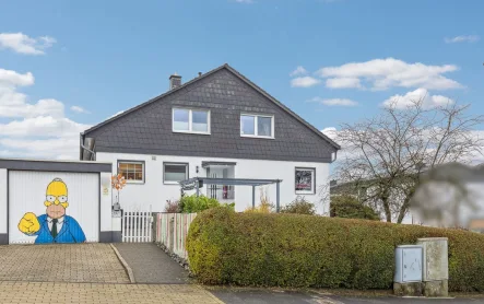 Titelbild - Haus kaufen in Hagen - Attraktives Einfamilienhaus mit 5 Zimmern einer Garage und Einliegerwohnung in Hagen - Haspe