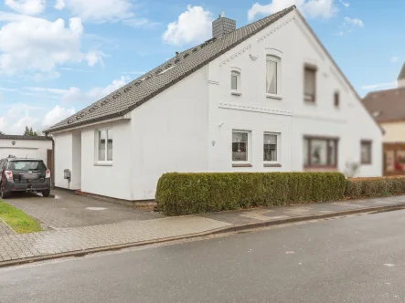 Titelbild - Haus kaufen in Rendsburg - Modernisierte Doppelhaushälfte mit schönem Garten in Rendsburg - Schleife