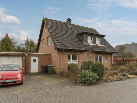 Titelbild - Haus kaufen in Warendorf - Charmantes Einfamilienhaus auf großzügigem Eckgrundstück: Ihr neues Zuhause in Warendorf