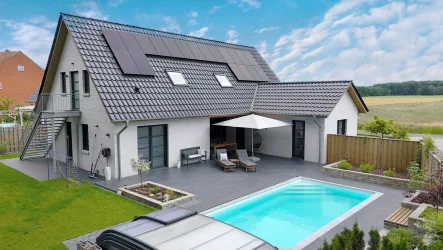 Titelbild - Haus kaufen in Syke - Traumhaftes Einfamilienhaus: Luxus trifft Nachhaltigkeit mit beheizbarem Pool in Sörhausen