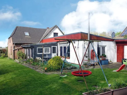 Headphoto - Haus kaufen in Neufeld-Kattrepel - Einfamilienhaus mit Erweiterungsanbau und Garage in Neufeld (Kattrepel)