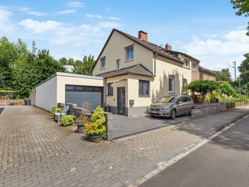 Titelbild - Haus kaufen in Herne - Doppelhaushälfte für Ihr Familienglück in ruhiger Lage von Herne-Röhlinghausen 