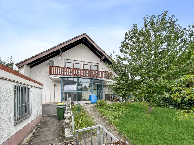 Titelbild - Haus kaufen in Rodgau - Einfamilienhaus mit viel Potenzial und weitläufigem Garten in ruhiger Lage in Rodgau