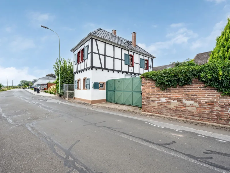 Titelbild - Haus kaufen in Zülpich - Vermietetes Einfamilienhaus in Zülpich-Lövenich