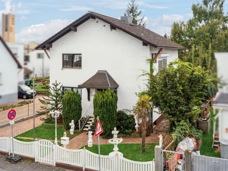 Titelbild - Haus kaufen in Mühlheim am Main - Attraktives Einfamilienhaus mit einzigartigen Gestaltungsmöglichkeiten in Mühlheim-Lämmerspiel